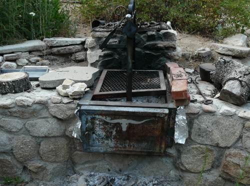 Build a barbacue into your garden wall. You can buy fancy ones or cheap ones that drop in.