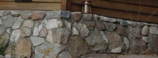 You can create a rock wall to cover an ugly foundation.
