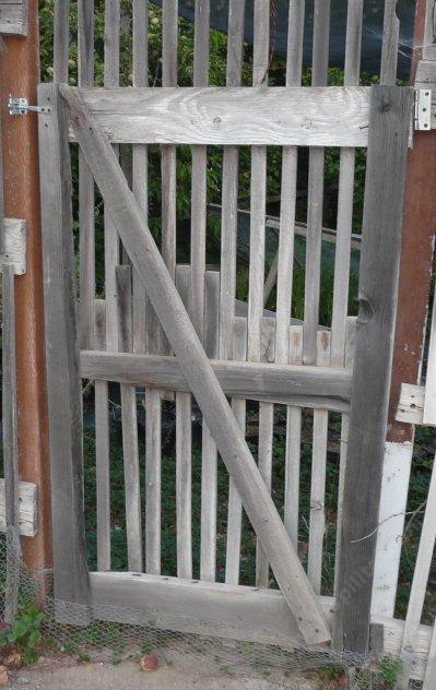 Larger gates just require larger hardware and structure. This one is 8 feet tall.