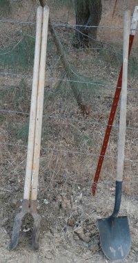 A post hole digger is useful for fence posts. Better than motorized ones in hard soils, but get a heavy one