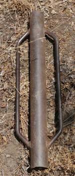 Buy the heaviest post tamp you can pick up. Light ones will not work in heavy soils.