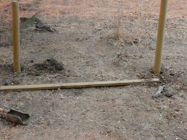 Lay your wood on the ground from corner in to determine where to dig.