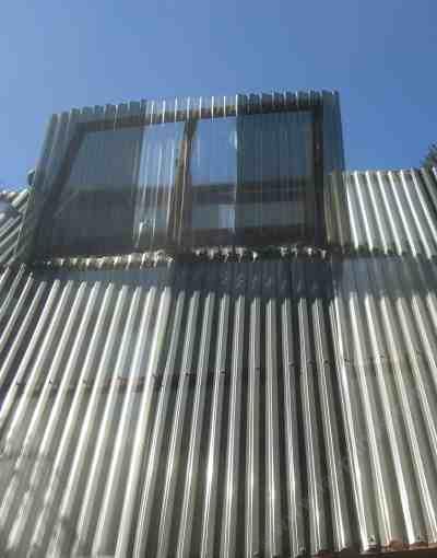 The higher you can get the 'out' vent the better it will work, unless you have regular wind, then it needs to go high on the leeward end.