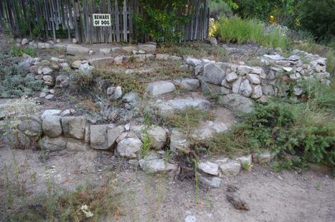 No it;s not a pile of rocks. It's a dry California garden with two rock walls and some steps.  - grid24_12