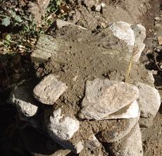 Treated wood into rock pillar. If it's not level the bench will rock,  and you will roll. - grid24_6