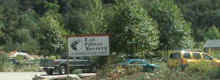 Las Pilitas parking lot sign and entrance