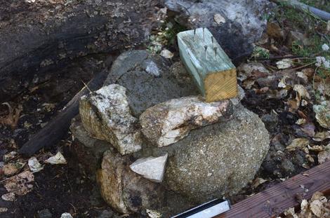 Here is the pillar for the bench  before the final cement and rock is put in place. The nails and screws go into the wet cement. - grid24_12