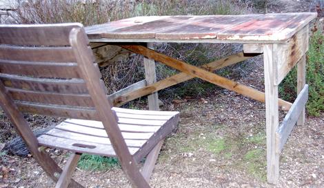 This outdoor table was built out of a gate, that had been built out of a fence. Took about 1 hour to build and a few screws and metal clips. - grid24_12