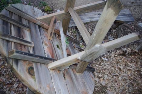 Here is an old commercial redwood table. Originally it was bolted to the top. Someone added a lot of nails, and it till kind of comes apart now and then. - grid24_12