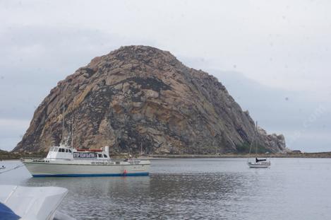 A Boat coming into the harbor at Morro Bay - grid24_12