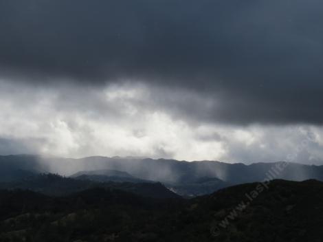 Mist coming down on the hills approaching the nursery. - grid24_12