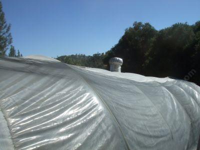 Turbine vent on top of one of he greenhouses, it didn't work all that hot but this greenhouse had real problems. Too low and the wind could not get to it.  A humid desert, if you watered much the moisture never left. - grid24_12