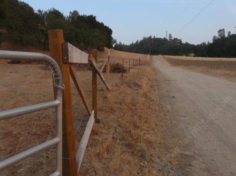 Fence bracing for  a long straight wire fence. The mind challenged  horses ate one of these cross pieces and broke it. - grid24_12